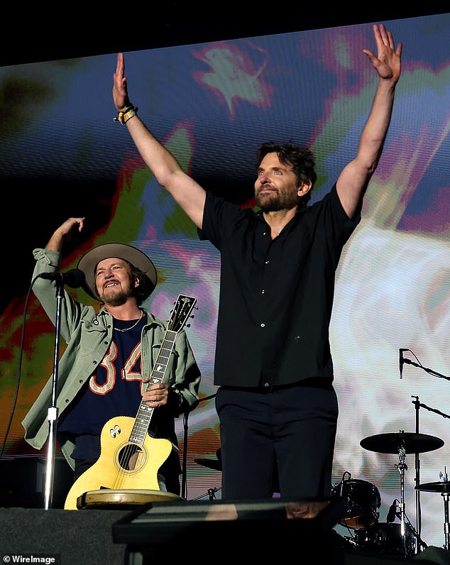 Later, Cooper took off his apron and sunglasses as he joined Pearl Jam's Eddie Vedder on stage