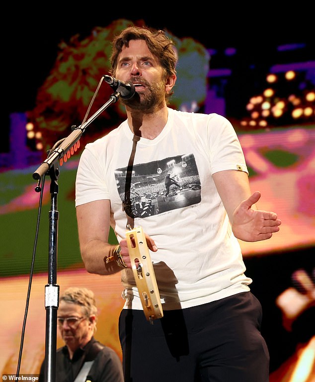 At the end of Pearl Jam's set, Cooper was seen rejoining the band after donning a graphic T-shirt and showing off his rhythm with a tambourine.