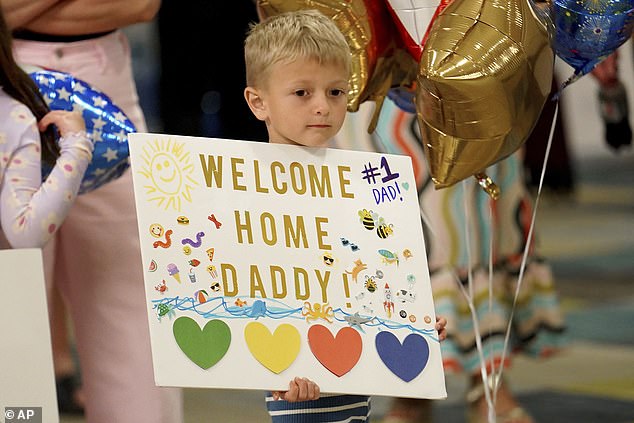 Palmer Hagerich, 4, awaits the arrival of his father, Bryan, at Pittsburgh International Airport on Friday, May 24, 2024