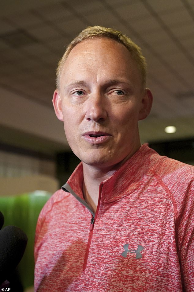 Bryan Hagerich (photo) talks to reporters at the airport.  Ryan Watson, 40, Tyler Scott Wenrich, 31, and Sharitta Shinse Grier, 45, are all in custody on the island, while Michael Lee Evans, 72, was released on bail and allowed to fly back to the US because he has a serious medical condition .