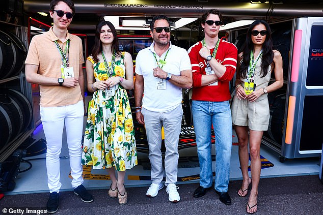 Frederic Arnault, Alexandra, Julien Tornare, Nicholas and Kelsey pose for a photo outside the Oracle Red Bull Racing garage