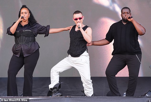 Olly stepped out in a black vest and white cargo pants for his raunchy appearance