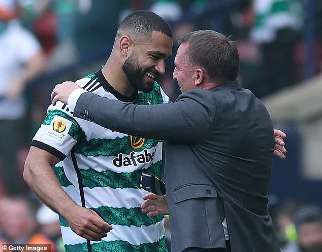 Manager Rodgers and Cameron-Vickers celebrate during the cup final