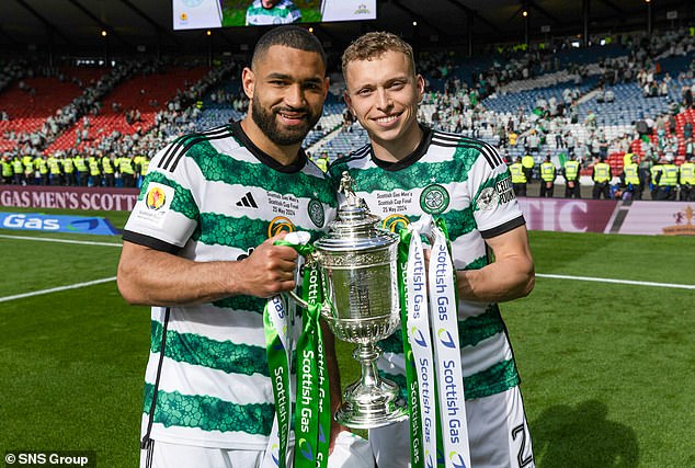 Cameron Carter-Vickers and full-back Alistair Johnston pose with the famous trophy