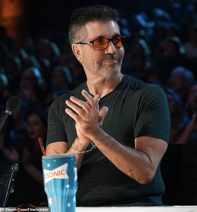 Simon Cowell has revealed why he often wears red-tinted glasses while filming