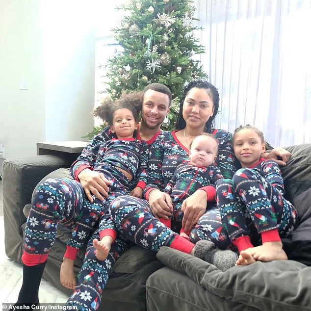 IMAGE: Stephen, Ayesha, Riley (far right), Ryan (far left) and Canon Curry (on Ayesha's lap)