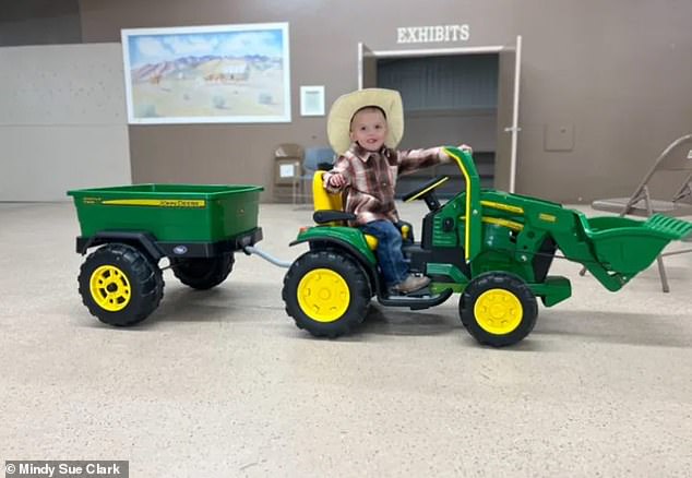 Kallie Wright dove in to save her three-year-old son as he drove his toy tractor into the raging river
