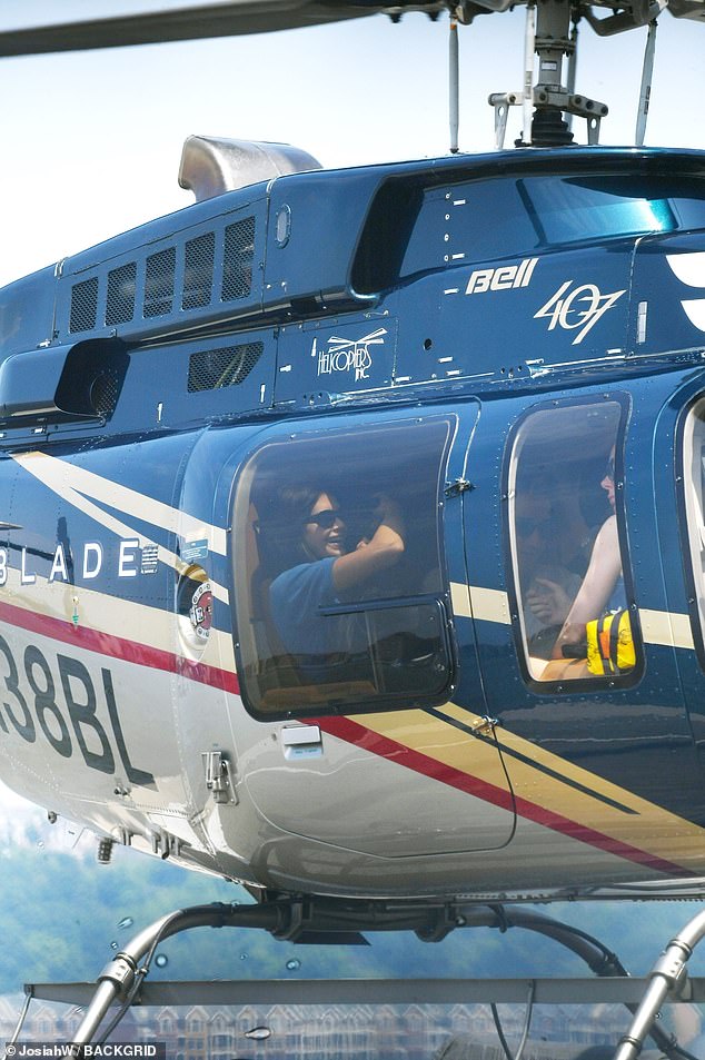 The LA resident was surrounded by friends in the helicopter as they prepared to leave the city