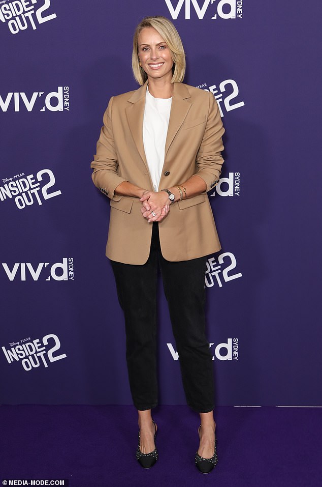 Current Affairs host Sylvia Jeffreys (pictured) kept it professional in a slightly oversized coffee-colored blazer and slim-fit trousers