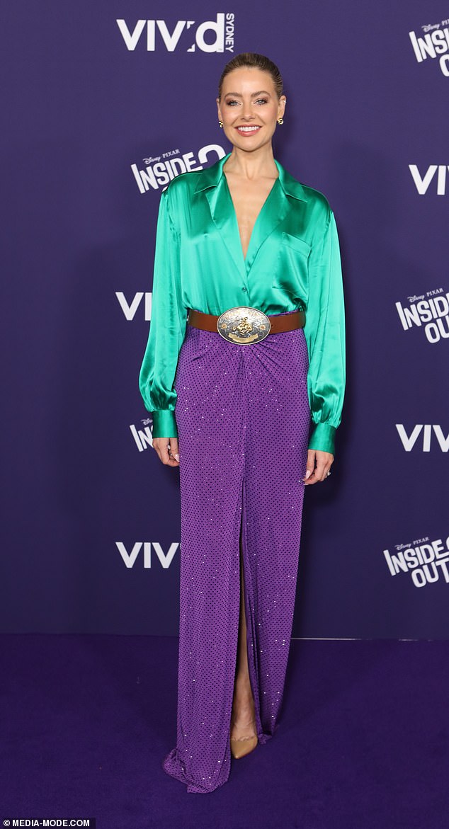 Neighbors actress April Rose Pengilly (pictured) looked radiant on the night in a green silk blouse paired with the unusual choice of a brown cowboy belt and a glittering purple skirt