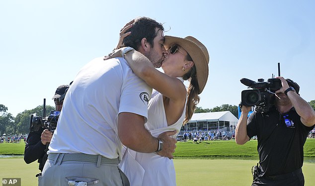 Riley kisses his wife Alexandra after scoring a big win on the PGA Tour on Sunday night