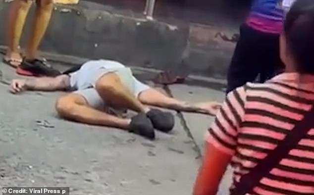 Moments later, the man is seen lying motionless on the ground after being kicked in the side of the head