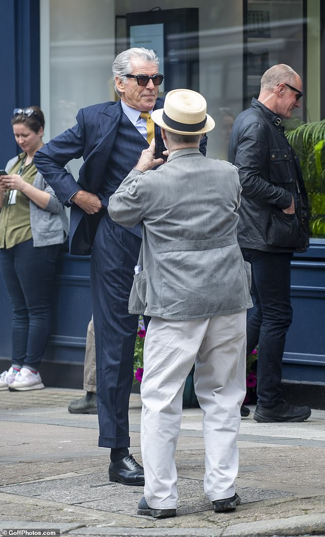 One fan in particular looked at Pierce in awe as he stopped to take photos of the actor