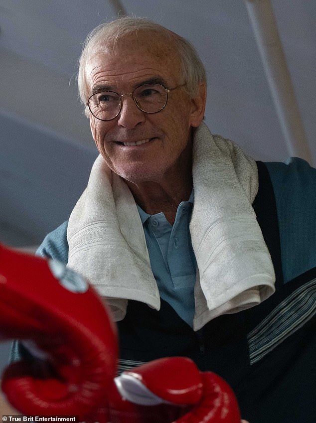 Pierce looked worlds away from his suave self in a new first look for his latest role in Prince Naseem Hamed's upcoming biopic, Giant, as boxing trainer Brendan Ingle