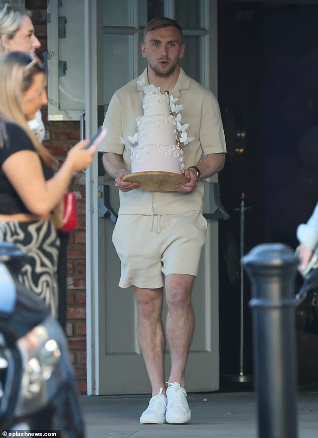 The couple appeared to have spared no expense for the special occasion, with Jarrod carrying a beautiful three-tiered cake