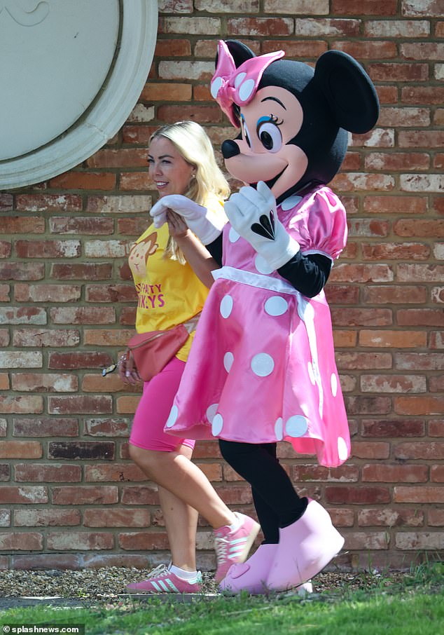 A Minnie Mouse mascot was seen arriving at the eatery with an employee