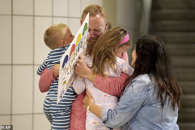 Video footage captured the heartwarming moment Hagerich, 39, arrived at the airport and immediately hugged his children and wife as he saw them for the first time since his arrest