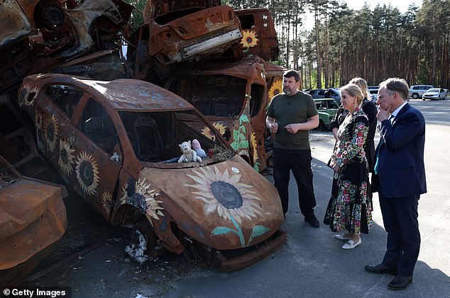 Sophie, 59, last month became the first member of the royal family to visit the country since the Russian invasion in February 2022. She and the UK's ambassador to Ukraine Martin Harris are pictured visiting the car cemetery on April 29, 2024 in Irpin.  , Ukraine