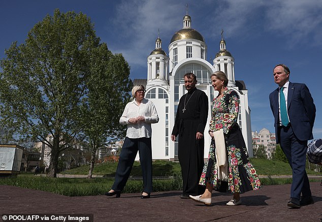 The Duchess of Edinburgh (second right) and the Ambassador of the United Kingdom to Ukraine Martin Harris (right) visit the monument to the victims of the Russian occupation in the city of Bucha on April 29, 2024