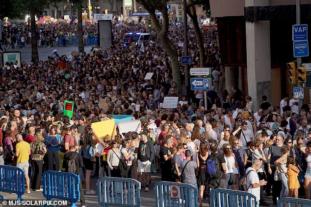 An estimated 15,000 locals joined the protest that wound through the capital Palma and headed towards Weyler Square, where holidaymakers flocked for food and drinks