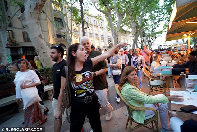 Protesters shout at shocked holidaymakers enjoying dinner and drinks in Palma