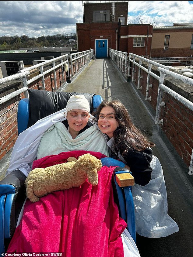 Olivia (left) with sister Phoebe at Northern General Hospital, two days after arriving in England, April 4