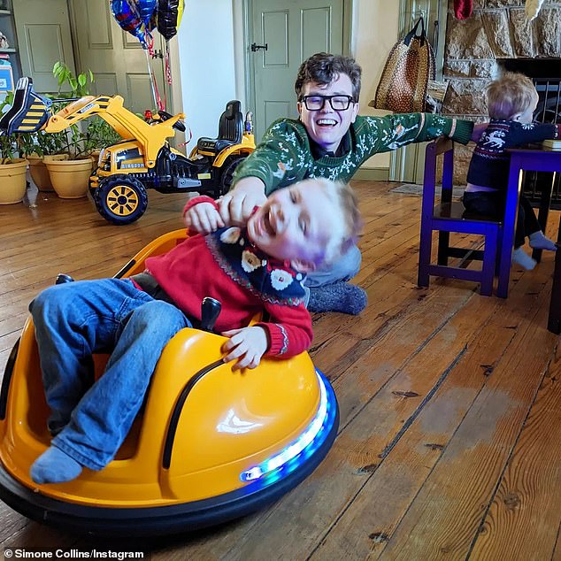 Malcolm plays with his children at their family's home in Pennsylvania