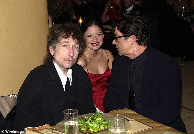 The late musician's children claim she took advantage of him in his declining years, unbeknownst to them, old friends like Dylan and the guitarist's ex-wife, Dominique Bourgeois.  The trio can be seen together in 2022