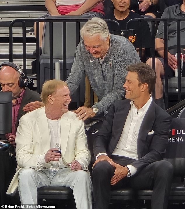 Brady is seen standing next to his Las Vegas Aces co-owner Mark Davis, who also owns the Raiders