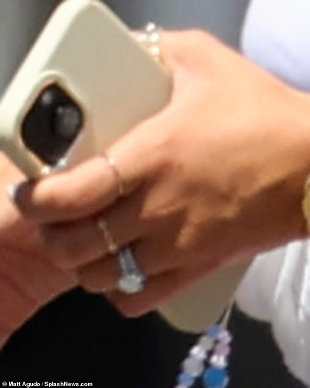 Millie showed off her dazzling diamond engagement ring and wedding band