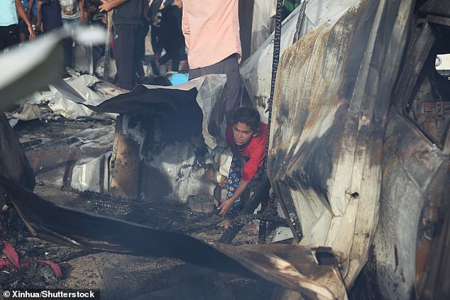 Child is seen at the scene of an Israeli attack on a displaced persons camp in Rafah in the southern Gaza Strip, May 27, 2024