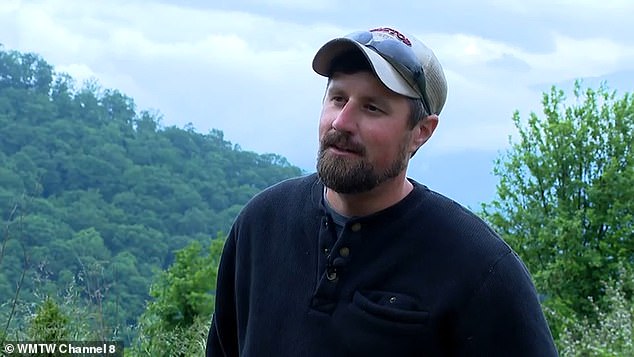 Justin Clontz (above) was working grounds maintenance at Glamping Collective, a luxury campground in Haywood County, North Carolina, when he made the stunning discovery.  he had to drag the 'UFO' out of the area with a lawnmower because it was so massive and heavy