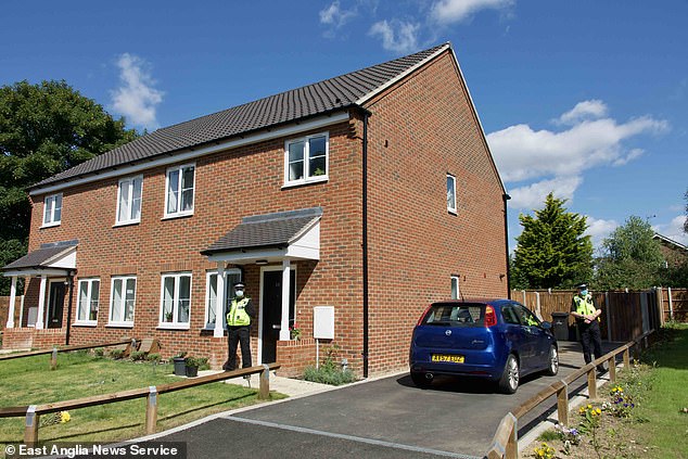 Police at the scene after Malgorzata Lechanska was shot dead by her husband Rafal Winiarski, 42, at their home in Shipdham, Norfolk