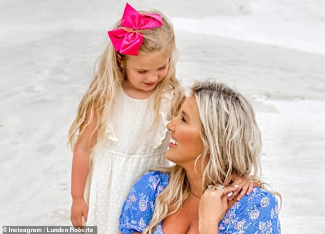 President Joe Biden and first lady Jill Biden only acknowledged last summer that they had a seventh grandchild.  Lunden Roberts (right) and Navy Joan (left) pose for a photo