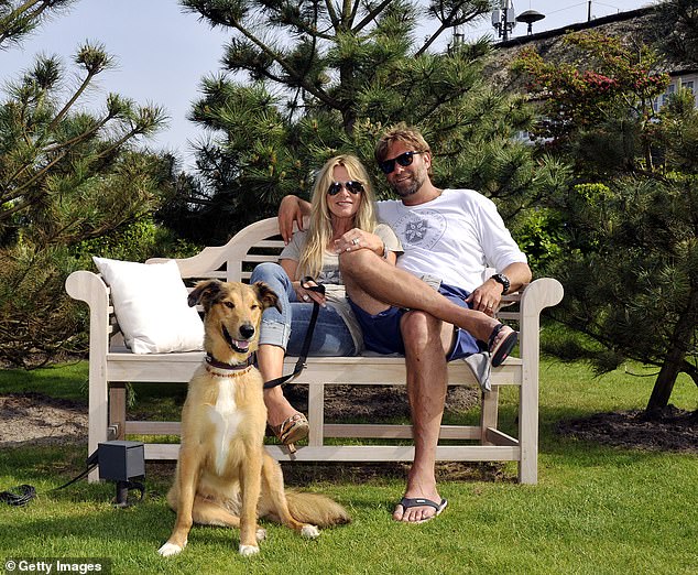 Klopp and Ulla, pictured with their dog Emma in 2013, moved in together after just three days