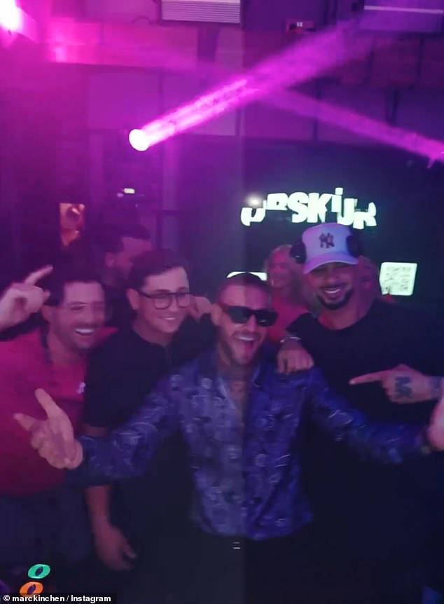 The UFC star posed for photos with several fans behind the DJ decks at the nightclub