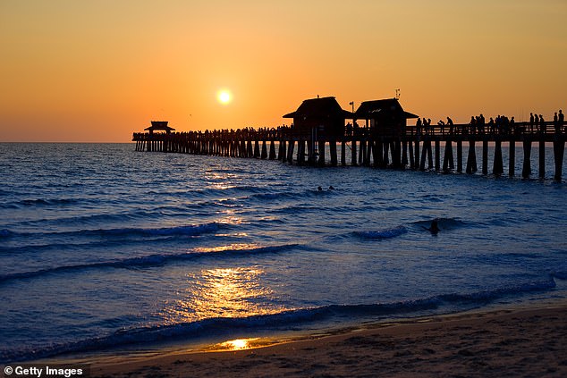 Razo, 20, and Zadok Westfield, 23, were caught on the Naples pier on Monday (pictured)