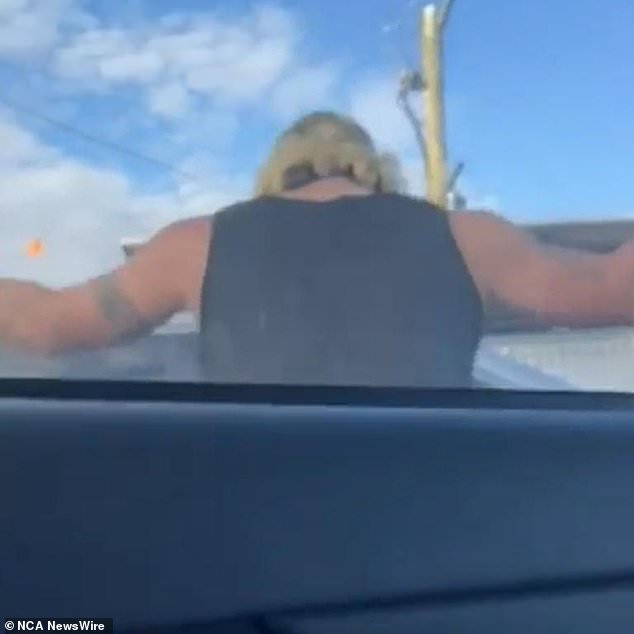 Terrifying footage of the incident shows a man gesturing aggressively at the driver of a car