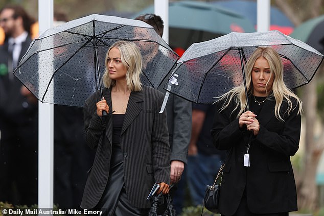 Those in attendance (pictured) heard moving eulogies from the late star's father Graham and sisters Hannah and Jessica