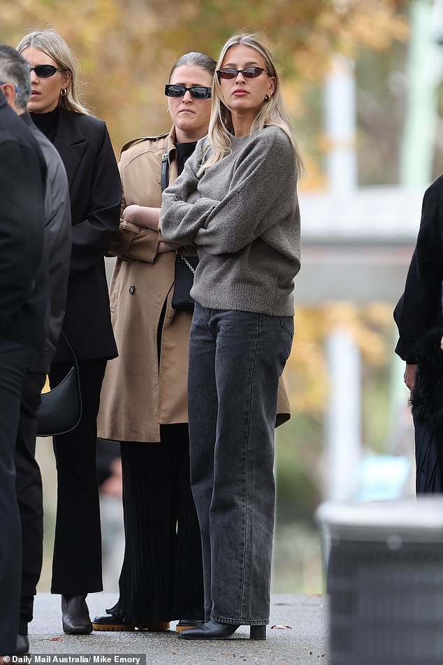 Pictured: Mourners outside the service in Fremantle on Wednesday morning, local time