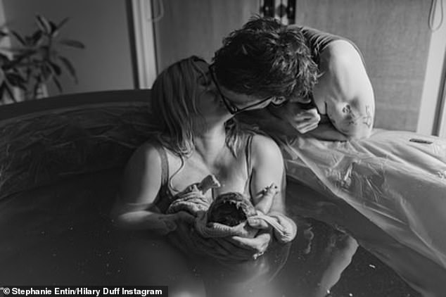 Duff shares beautiful black and white photos from her emotional home water birth, as well as the very first images of baby Townes