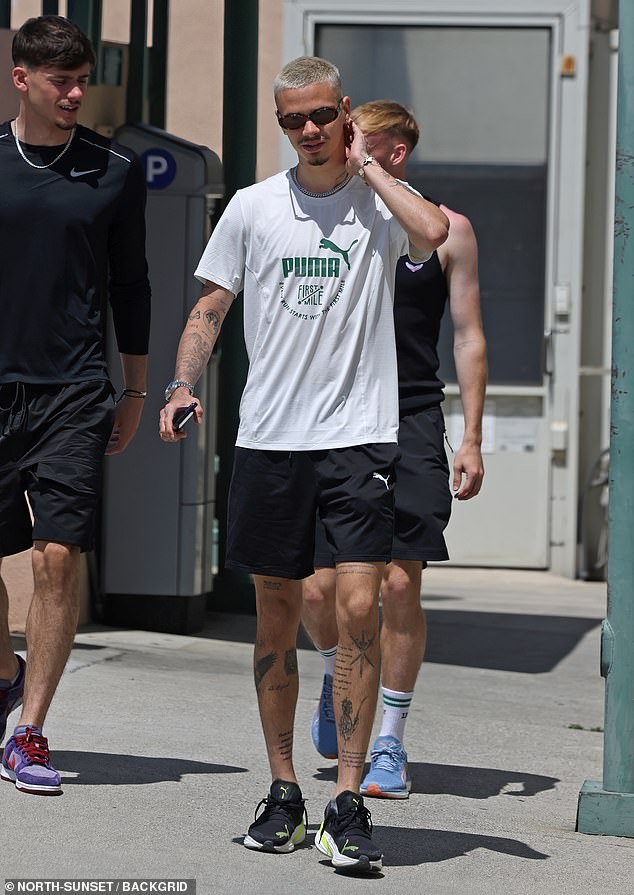 The footballer, 21, was dressed from head to toe in Puma while accessorizing with stylish brown shades and silver jewelery as he headed to an Italian lunch at Jon & Vinny's