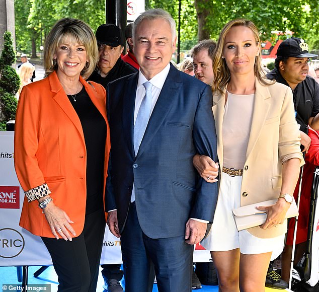 Holmes pictured with Ms Langsford (left) and Ms Webster (right) at the TRIC Awards in London in 2022. Standing alongside his co-host Ms Webster, the 64-year-old broadcaster said: 'Just before we go on, we'd like to thank people for your support for Ruth and me in recent days regarding the news of our divorce'