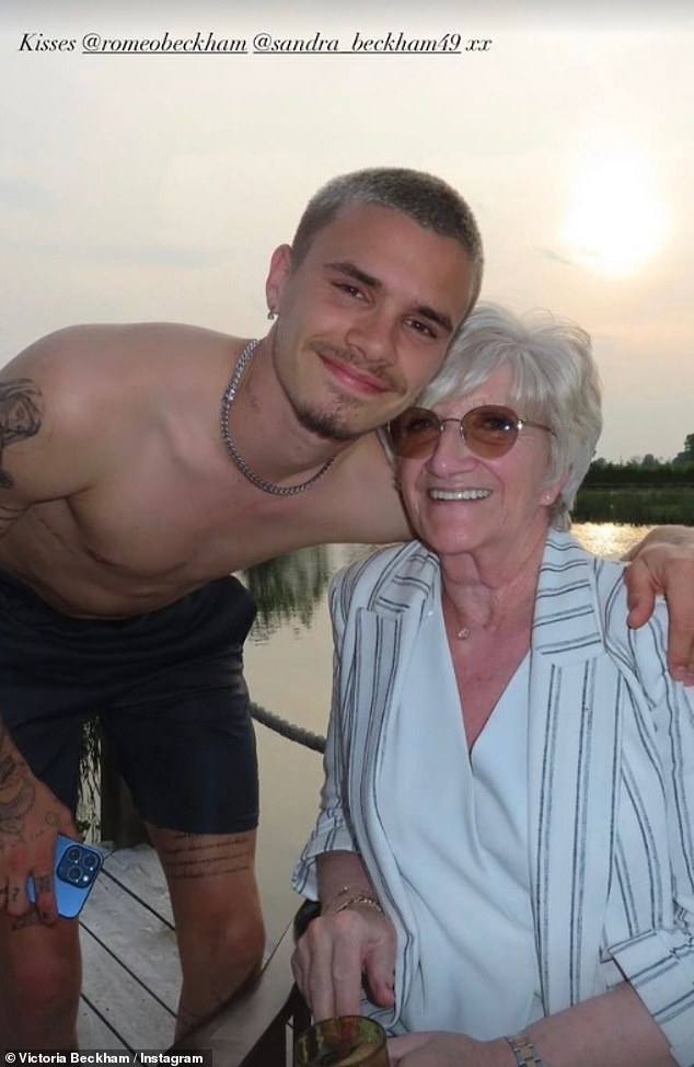 Elsewhere, Romeo beamed as he snapped a sweet photo with his grandmother Sandra by the lake