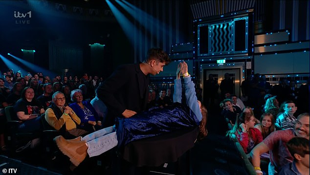 During their performance they asked a young girl from the audience to participate in a floating trick