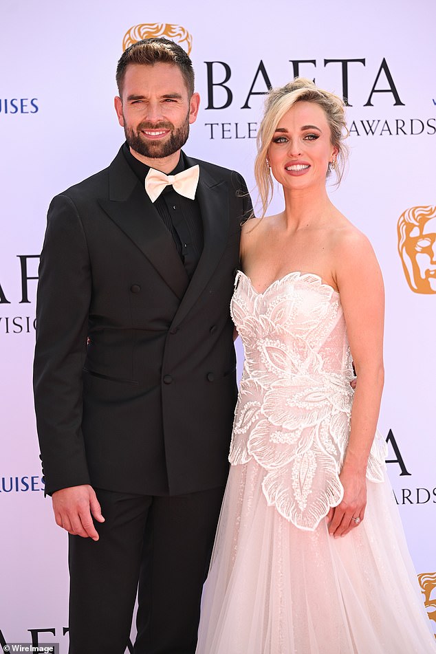 “For me, when I talk about babies, I'm like "Yes, let's"', she said in the previous episode.  'But Oliver, it's a bit of a preliminary topic because he obviously knows the past situations, what we've been through and also the risks (pictured at the BAFTAs on May 12)