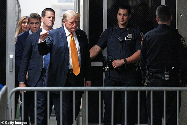 When he arrives at the court, he walks along the railing that determines where he can address the cameras