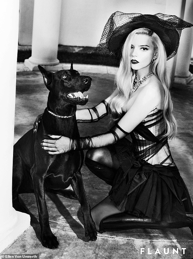 She also took a break with a dog while wearing a black corset dress