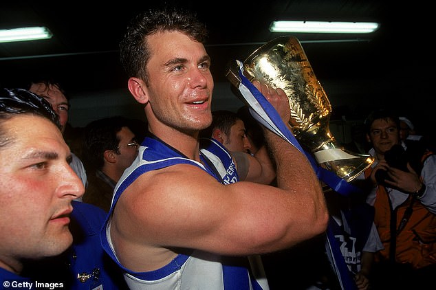 Carey won two AFL premierships with the Kangaroos in 1996 (pictured) and 1999