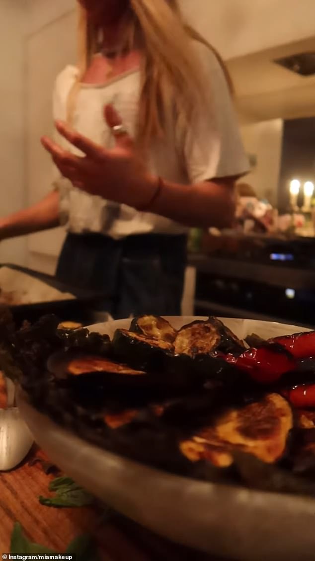 Christian, an aspiring Hollywood actor, showed off his culinary skills as he put the finishing touches on a plate of antipasto and then seasoned some fish